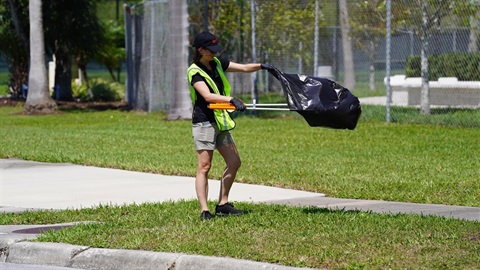 Person picking up trash