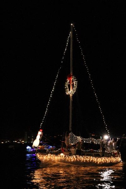 sailboat in the water decorated with Christmas decor