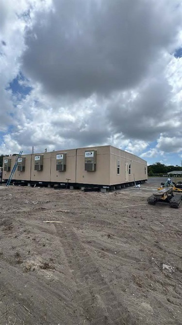 trailers in open field with electric bikes 