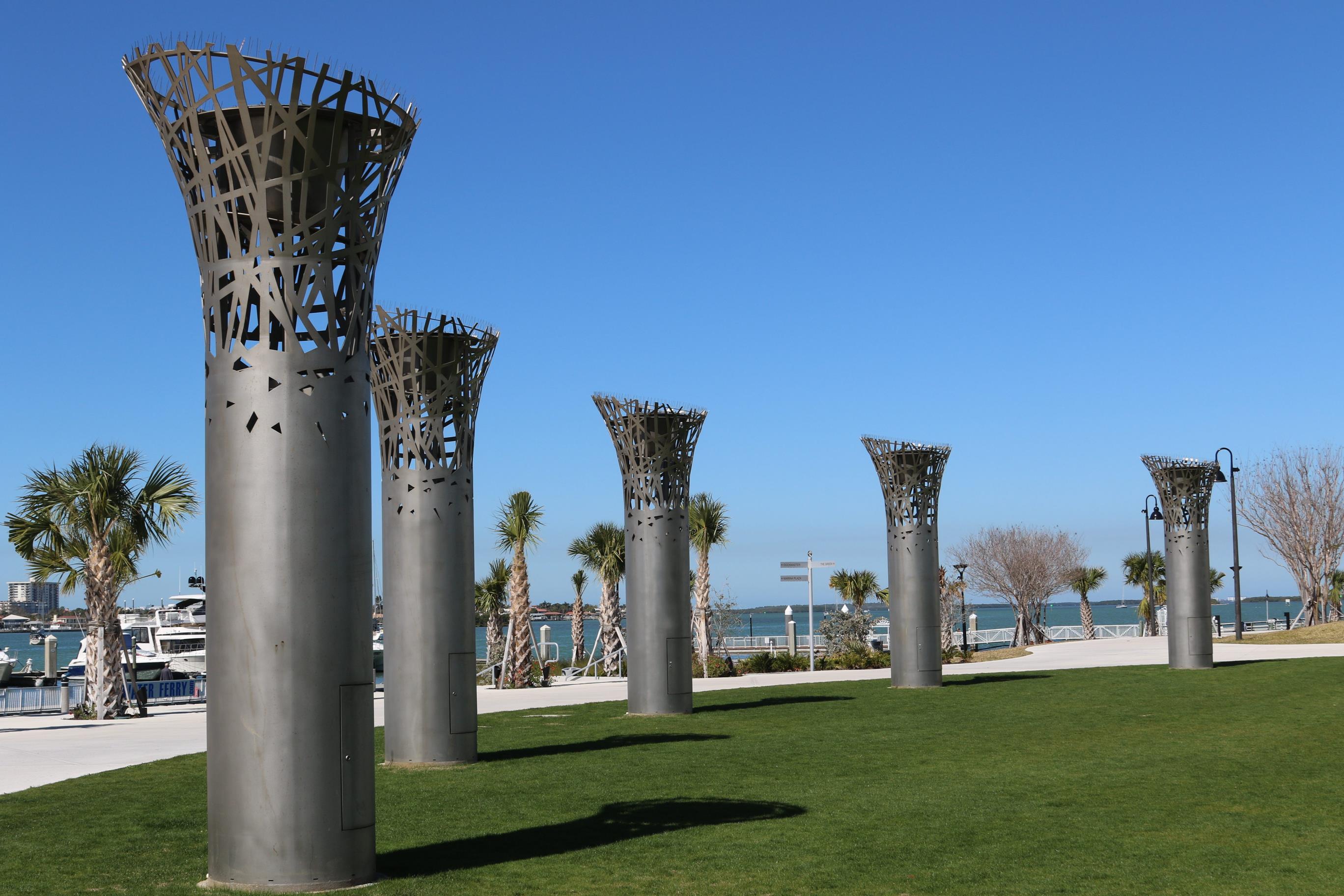 Clearwater riverwalk park with ten foot tall metal torch sculptures
