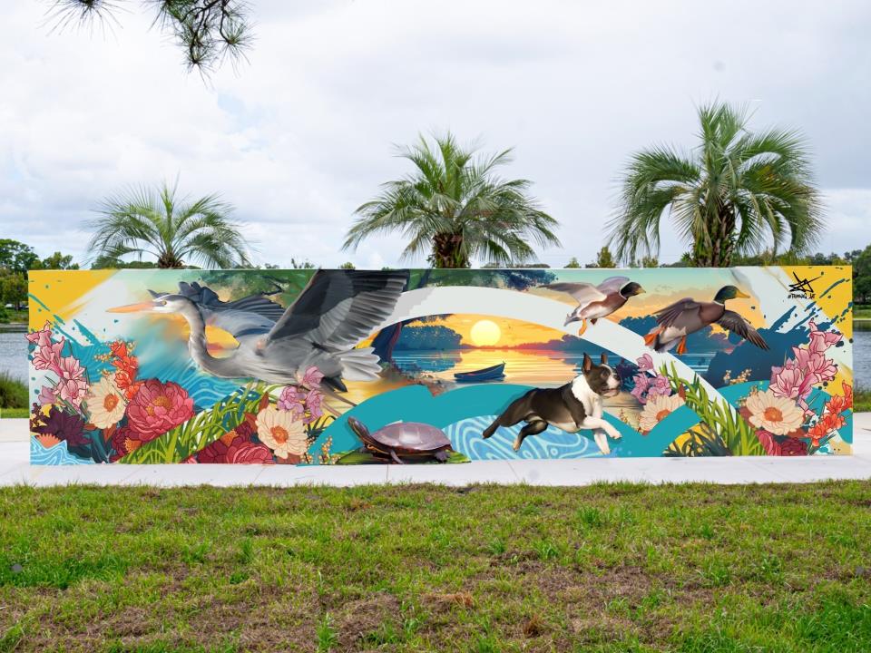 Outdoor wall with mural of animals and flowers.