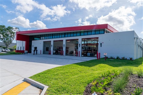 Street level view of fire station forty seven with all four doors open