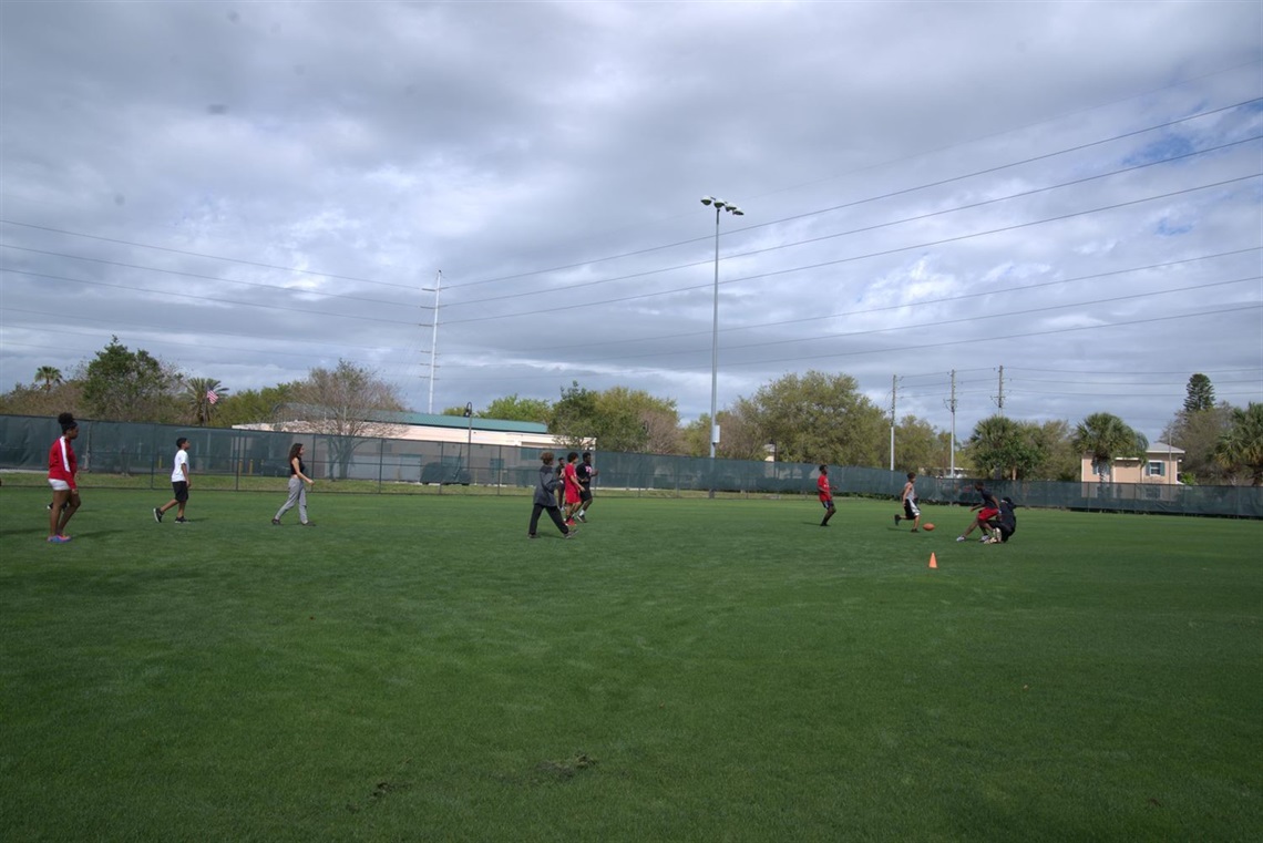 Kids playing soccer on field