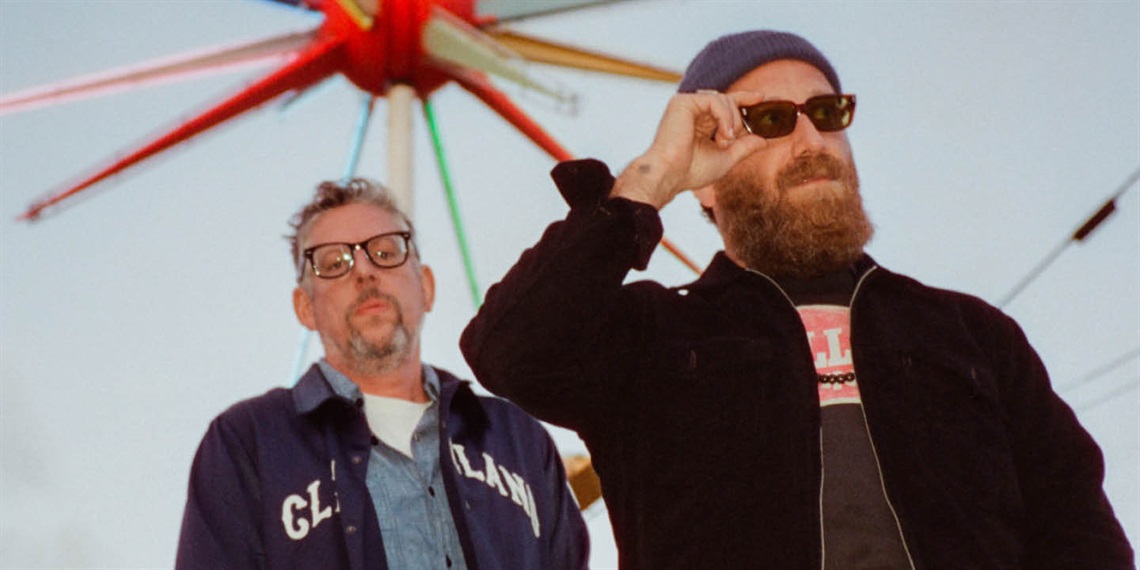 Two men, one with sunglasses on.