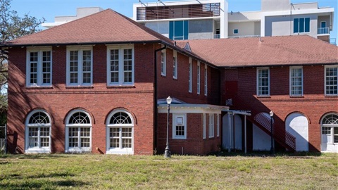 Two story red brick building.
