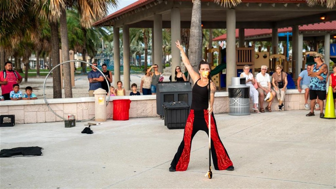 Image of pavilion with female performer and microphone