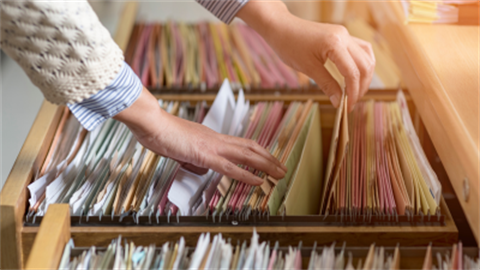 Image of filing cabinet with documents showing