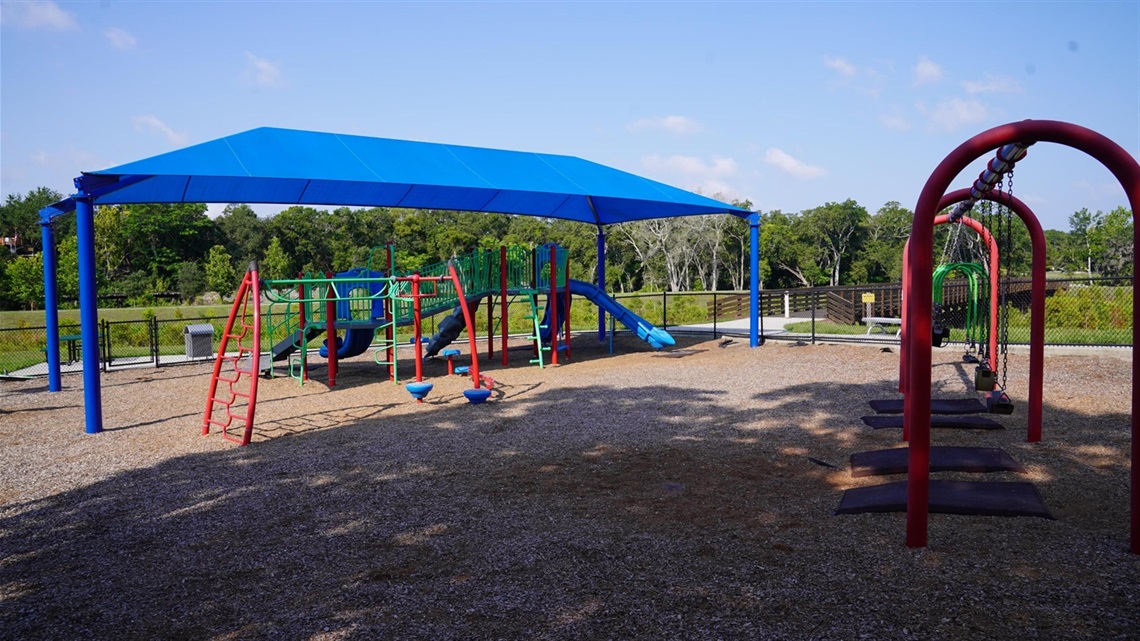 playground with swingset and playground equipment