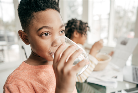 Boy drinking water.png